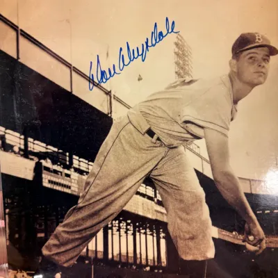 Vintage black and white photograph of Brooklyn Dodgers pitcher Don Drysdale in a pitching pose, signed in blue ink across the upper left.