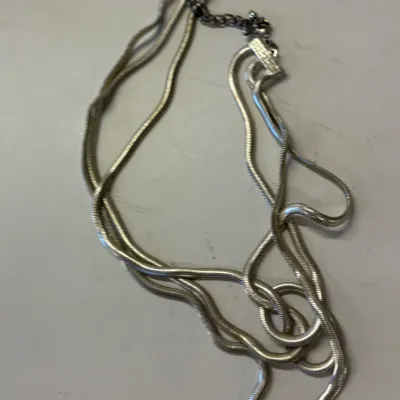 Vintage silver-tone multi-strand snake chain necklace with an adjustable lobster claw clasp.