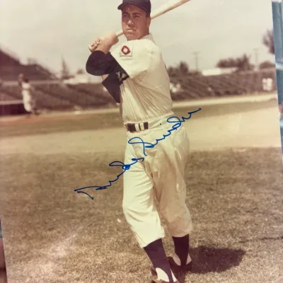 Autographed vintage photograph of Duke Snider in a Brooklyn Dodgers uniform, signed in blue ink across the center.