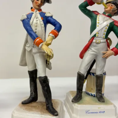 Pair of vintage Goebel porcelain military figurines, featuring an "Officier de la Garde 1786" and a "Cuirassier 1812"...