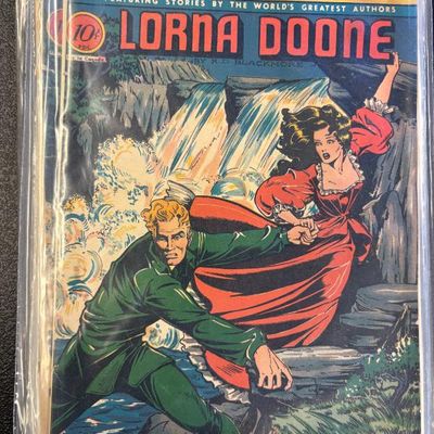Classic Comics issue No. 32, featuring "Lorna Doone" by R.D. Blackmore, preserved in a protective plastic sleeve.