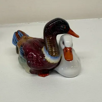 Vintage HEREND porcelain figurine depicting a pair of nesting ducks, featuring a colorful mallard alongside a white duck with a glossy...