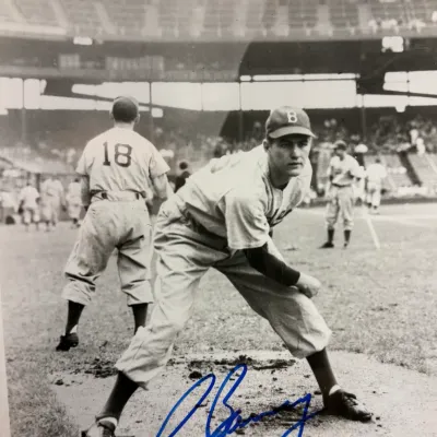 Autographed black and white photograph of Brooklyn Dodgers pitcher Rex Barney, signed in blue ink across the bottom.