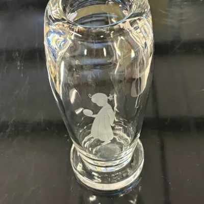 Orrefors crystal vase featuring an etched design of a girl holding a bird, designed by Sven Palmqvist.