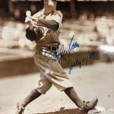 Autographed black and white photograph of baseball player Al Rosen, signed in blue ink and dated July 11, 1989.