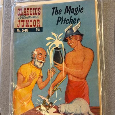 Classics Illustrated Junior comic book, No. 548, "The Magic Pitcher," packaged in a protective plastic sleeve.