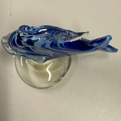 Hand-blown art glass fish figurine featuring swirled cobalt and light blue tones on a clear glass base.