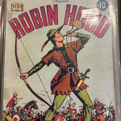 Vintage Classic Comics Library Presents Robin Hood No. VII comic book, priced at 10 cents, showing some wear and stored in a protective...