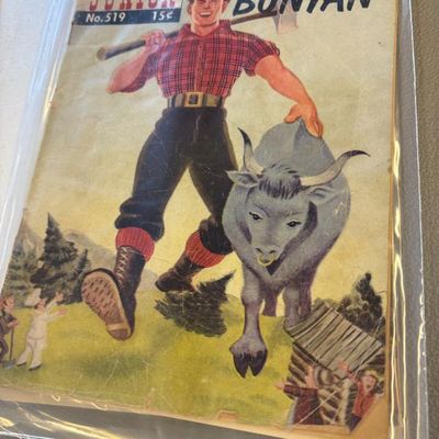 Vintage Classics Illustrated Junior comic book, No. 519, featuring Paul Bunyan, showing some wear and stored in a protective plastic sleeve.