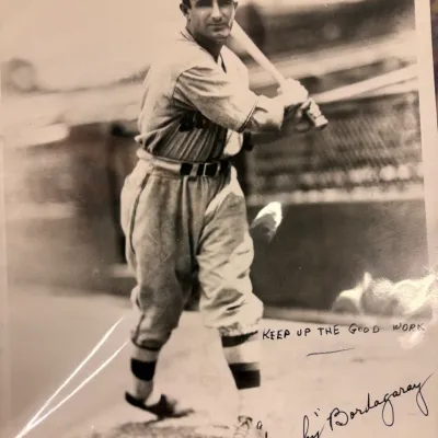 Vintage black and white photograph of baseball player Frenchy Bordagaray in a batting stance, featuring a handwritten inscription and...