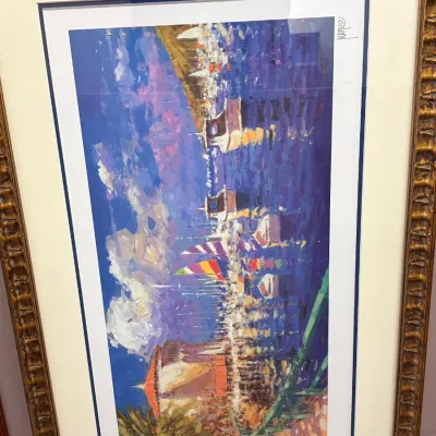 Framed impressionistic print by artist Marko, depicting a vibrant harbor scene with sailboats, housed in an ornate gold-gilded and wood...