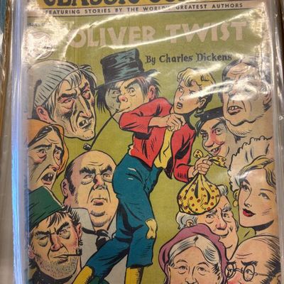Vintage Classic Comics No. 23 Oliver Twist comic book, featuring the Charles Dickens story, preserved in a protective plastic sleeve.