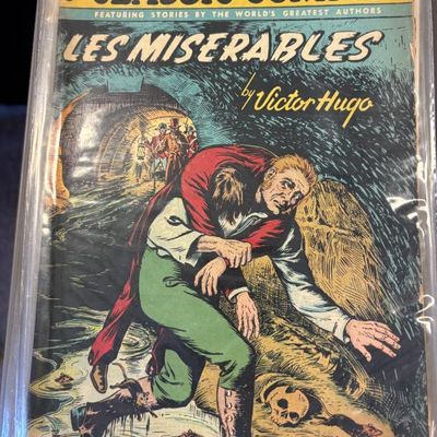 Vintage Classic Comics No. 9 featuring Les Miserables by Victor Hugo, preserved in a protective plastic sleeve.