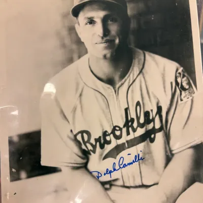 Vintage black and white photograph of Brooklyn Dodgers player Dolph Camilli, featuring a blue ink signature across the front.