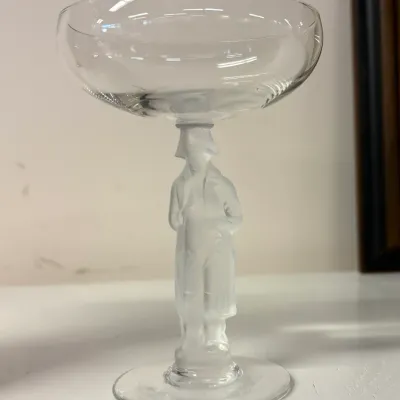 Vintage crystal champagne coupe featuring a frosted glass stem sculpted in the likeness of Napoleon Bonaparte.
