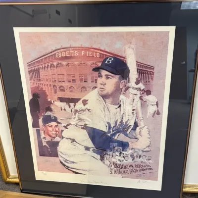 Framed and matted limited edition print featuring Duke Snider and the 1952 Brooklyn Dodgers at Ebbets Field, signed by the artist and...