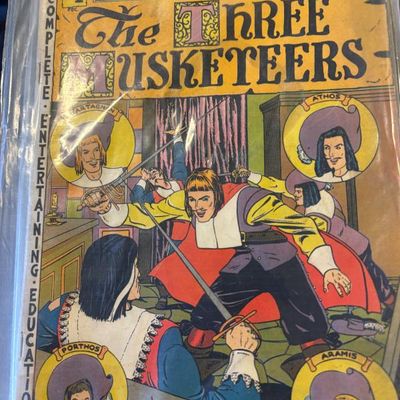 Vintage copy of Classic Comics No. 1, "The Three Musketeers" by Alexandre Dumas, showing some wear and stored in a protective...