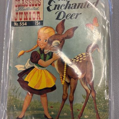 Classics Illustrated Junior comic book, No. 554, "The Enchanted Deer," preserved in a protective plastic sleeve.