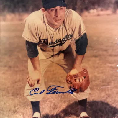 Autographed vintage photograph of Brooklyn Dodgers player Carl Furillo in uniform, featuring a blue ink signature.