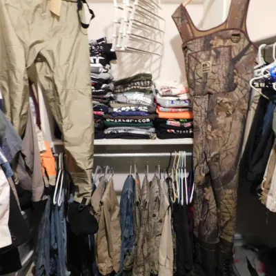 Closet full of hunting clothing