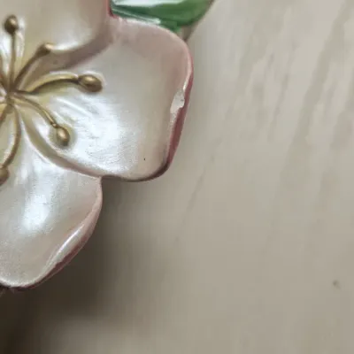 Sale Photo Thumbnail #65: Vintage 1990s Fitz & Floyd "Garden Rhapsody" ceramic basket featuring a charming sculpted duckling resting among pastel floral and twisted vine details. Small chip on Flower. Please see pic.