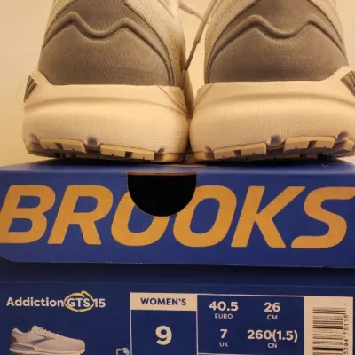 Sale Photo Thumbnail #356: • Model: Brooks Addiction GTS 15
• Gender/Size: Women's Size 9
• Width: Medium / B
• Colorway: Vaporous Grey / Primer Grey / Sand
• Style Number: 120352 1B 156
Includes Box