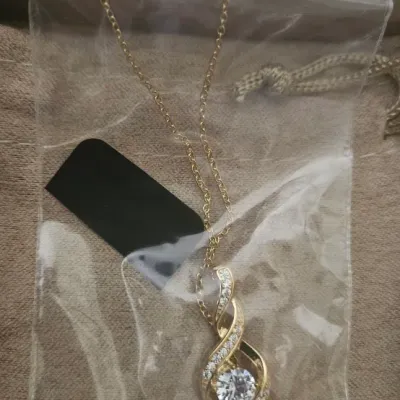 Sale Photo Thumbnail #118: This exclusive jewelry line focuses primarily on rhodium, sterling silver, and gold over sterling silver designs meticulously set with precision-cut white and colored diamond simulants/cubic zirconia stones.