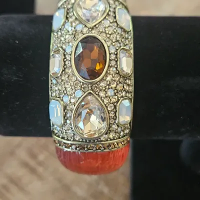 Sale Photo Thumbnail #185: Heidi Daus Signature Cuff Bangle Hinged Bracelet, heavily embellished with a striking combination of large teardrop, oval, and rectangular gemstones alongside intricate pavé crystal details.