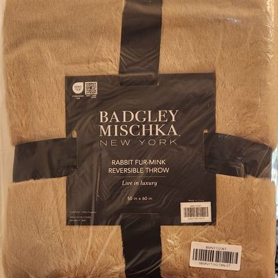 Sale Photo Thumbnail #340: BADGLEY MISCHKA 
NEW YORK 
REVERSIBLE THROW
50" X 60"
COLOR: TAN
Unopened
