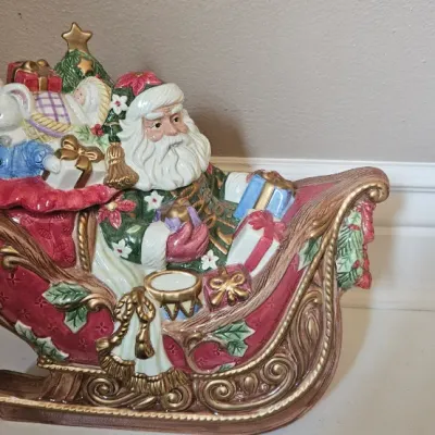 Vintage Fitz & Floyd 2003 Santa's Sleigh Large Ceramic Cookie Jar, which features Santa Claus in a hand-painted red and gold...