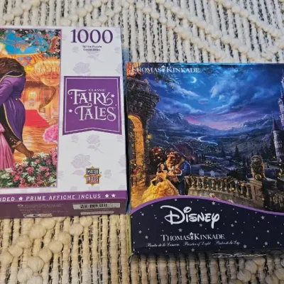 Sale Photo Thumbnail #68: Two Disney Beauty and the Beast Puzzles. One is 1000 pieces and the other is 750 Thomas Kinkade puzzle. I believe one of them is missing 1 puzzle piece.