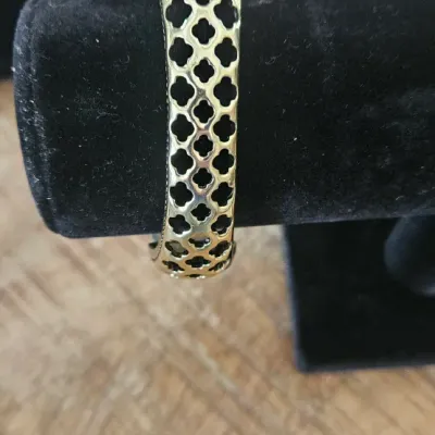 Sale Photo Thumbnail #186: Heidi Daus Signature Cuff Bangle Hinged Bracelet, heavily embellished with a striking combination of large teardrop, oval, and rectangular gemstones alongside intricate pavé crystal details.