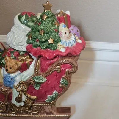 Vintage Fitz & Floyd 2003 Santa's Sleigh Large Ceramic Cookie Jar, which features Santa Claus in a hand-painted red and gold...
