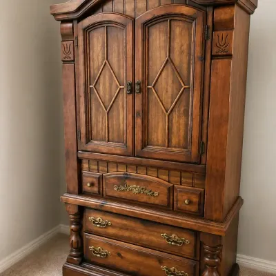 DETAILED AND CARVED ARMOIRE