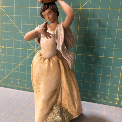 Sale Photo Thumbnail #216: 1970 Lladro "Florista camminante y pajarito" boxed". Like new no chips or flaws