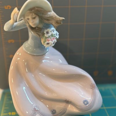 Sale Photo Thumbnail #221: "Lladro ""Blustery Day"" #5.588 boxed" Like new condition, no chips or flaws