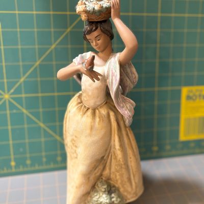 Sale Photo Thumbnail #218: 1970 Lladro "Florista camminante y pajarito" boxed". Like new no chips or flaws