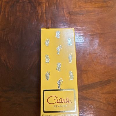 Vintage box of Ciara by Revlon 80 strength concentrated cologne spray, 2.3 fl oz, featuring a yellow package with silver classical figures.