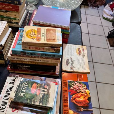 Assortment of vintage cookbooks, diet guides, and reference books, including titles like "Fit for Life" and "The Silver...