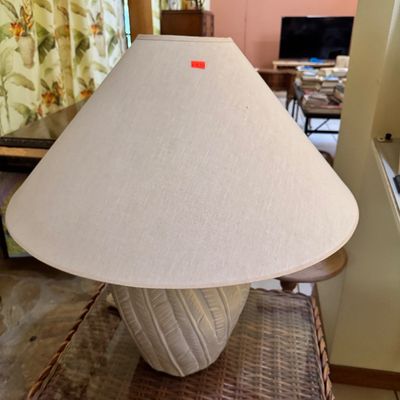 Vintage ceramic table lamp with a textured, ribbed base in an off-white finish, paired with a large matching fabric shade.