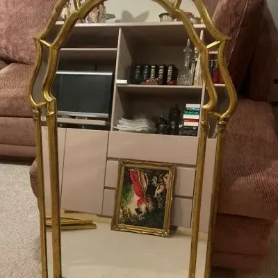 Two gold-framed mirrors