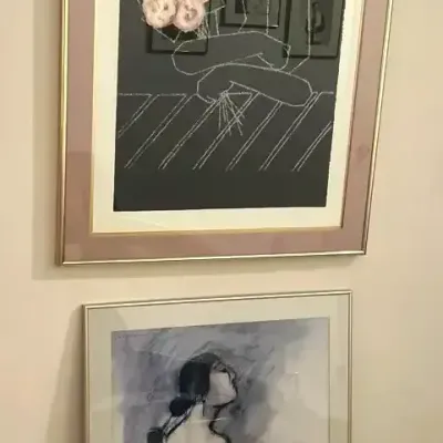 Set of two framed art reproductions. R.C Gorman, and Yama floral