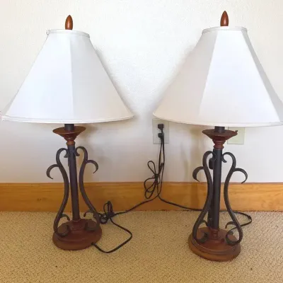 Pair of table lamps with black scrollwork iron base, wooden accents