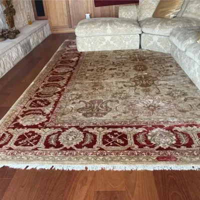 Oriental area rug W/striking maroon border & beige floral - With Pad