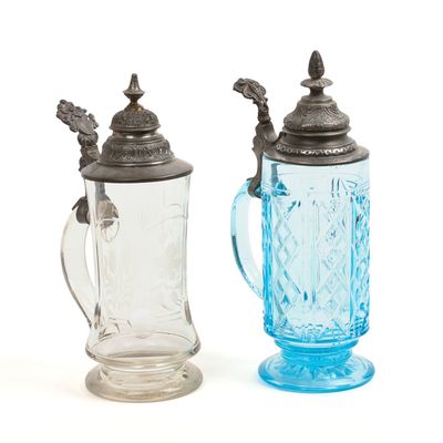 Sale Photo Thumbnail #177: Two Glass Steins With Pewter Tops.