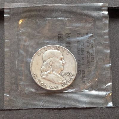 Sale Photo Thumbnail #241: 1958-D Franklin 90% Silver Half Dollar - Littleton Coin Packaging - Good Condition