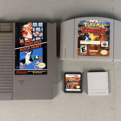 Sale Photo Thumbnail #147: Nintendo Plastic Video Games & Memory Card