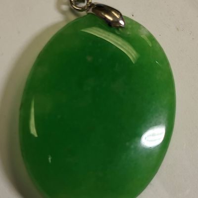 Sale Photo Thumbnail #3: oval jade & 18k gp pendant 67.5 carats