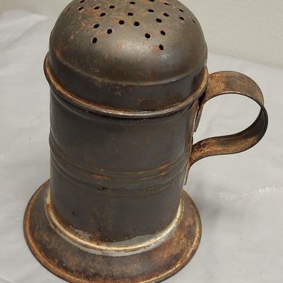 Sale Photo Thumbnail #30: antique made in England tin footed sugar shaker primitive