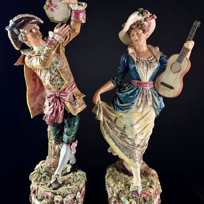 A Pair of Large Continental Polychrome Porcelain Musician Figurines